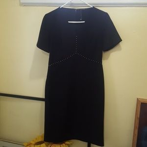 A black TAHARI  fitting dress with shiny beats